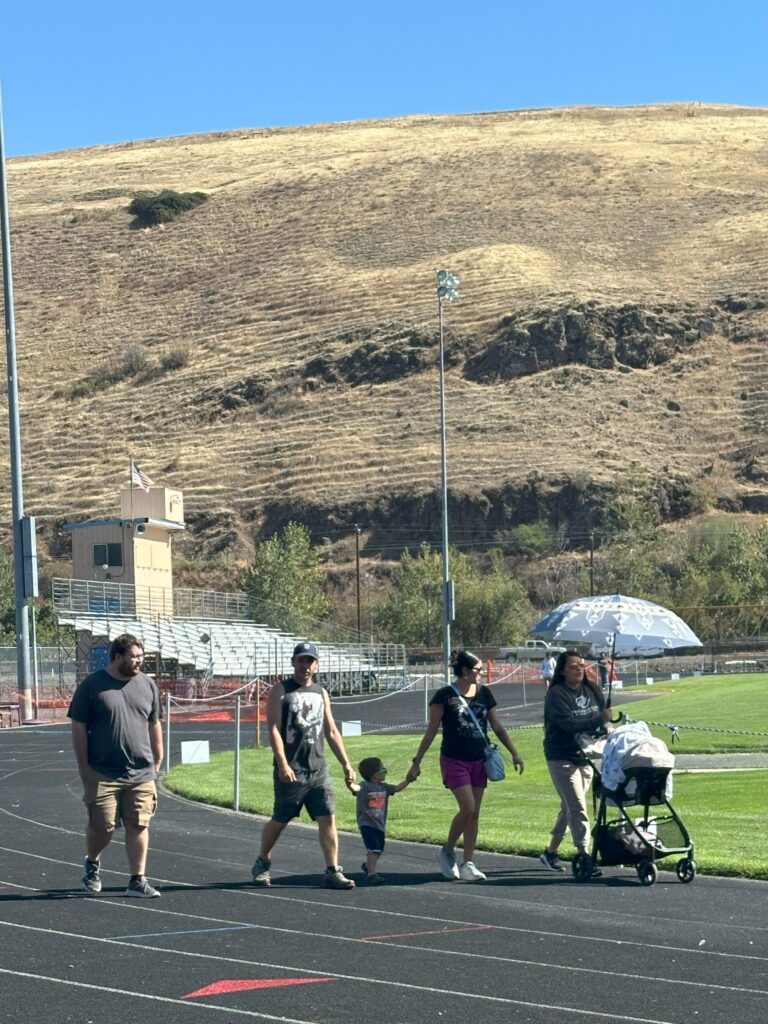 Over 185 participants walk the Lapwai High School track during Nimiipuu Health’s annual Suicide Awareness & Remembrance Walk on Sept. 24, 2025.